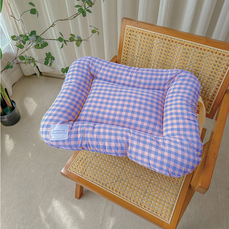 purple and pink gingham cat bed